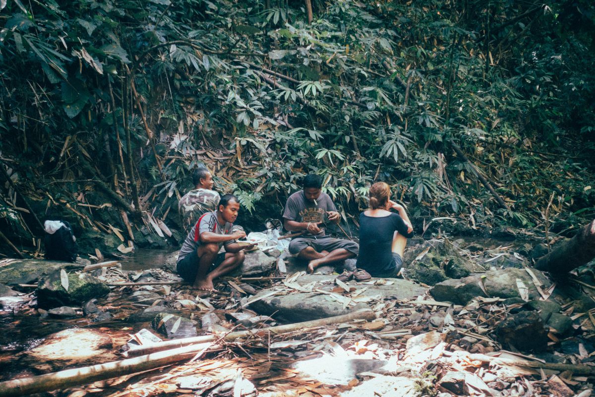 Having lunch with the guide and the rangers in the wilderness