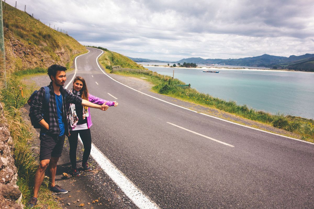 Tulu, Yvonne, and I trying to hitchhike back to Dunedin