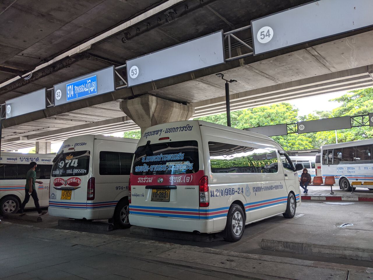 Vans parking at the Morchit Bus Terminal in Bangkok, Thailand.