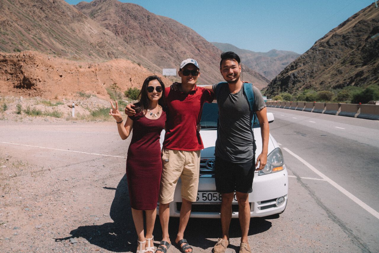 2 Kyrgyz locals and a hitchhiker in Bishkek, Kyrgyzstan