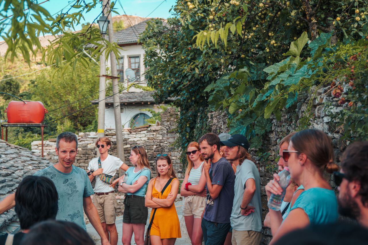 People on a free walking tour in Gjirokaster, Albania