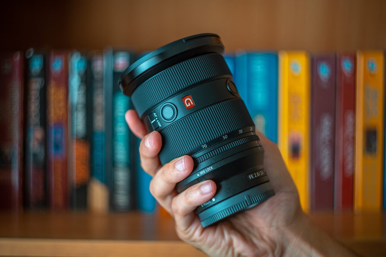 A person holding the Sony 24-70mm F2.8 GM II lens