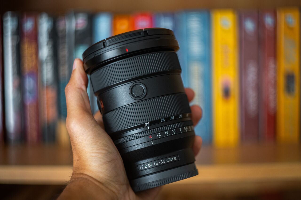 A person holding the Sony 16-35mm F2.8 GM II Lens