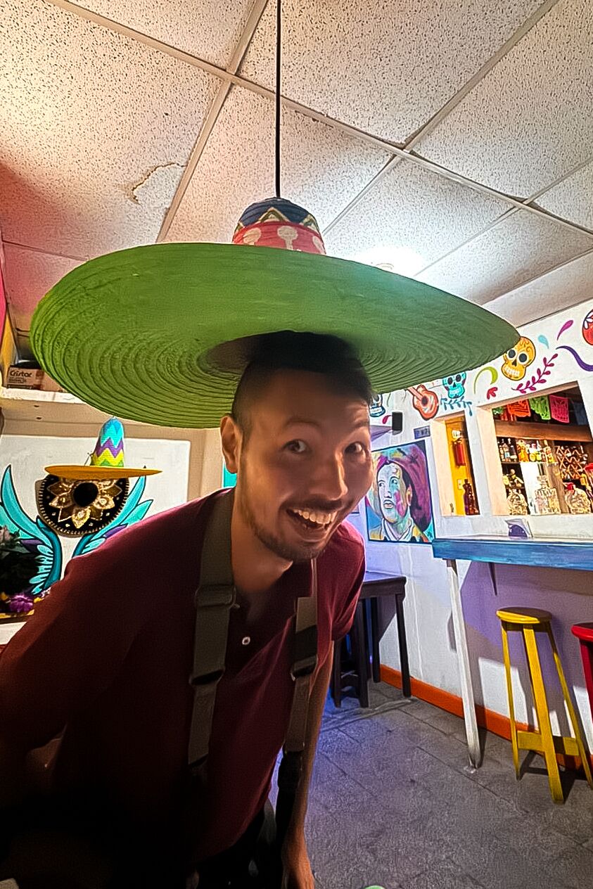 Me in a sombrero shaped pendant light at Mexico Lindo Restaurant