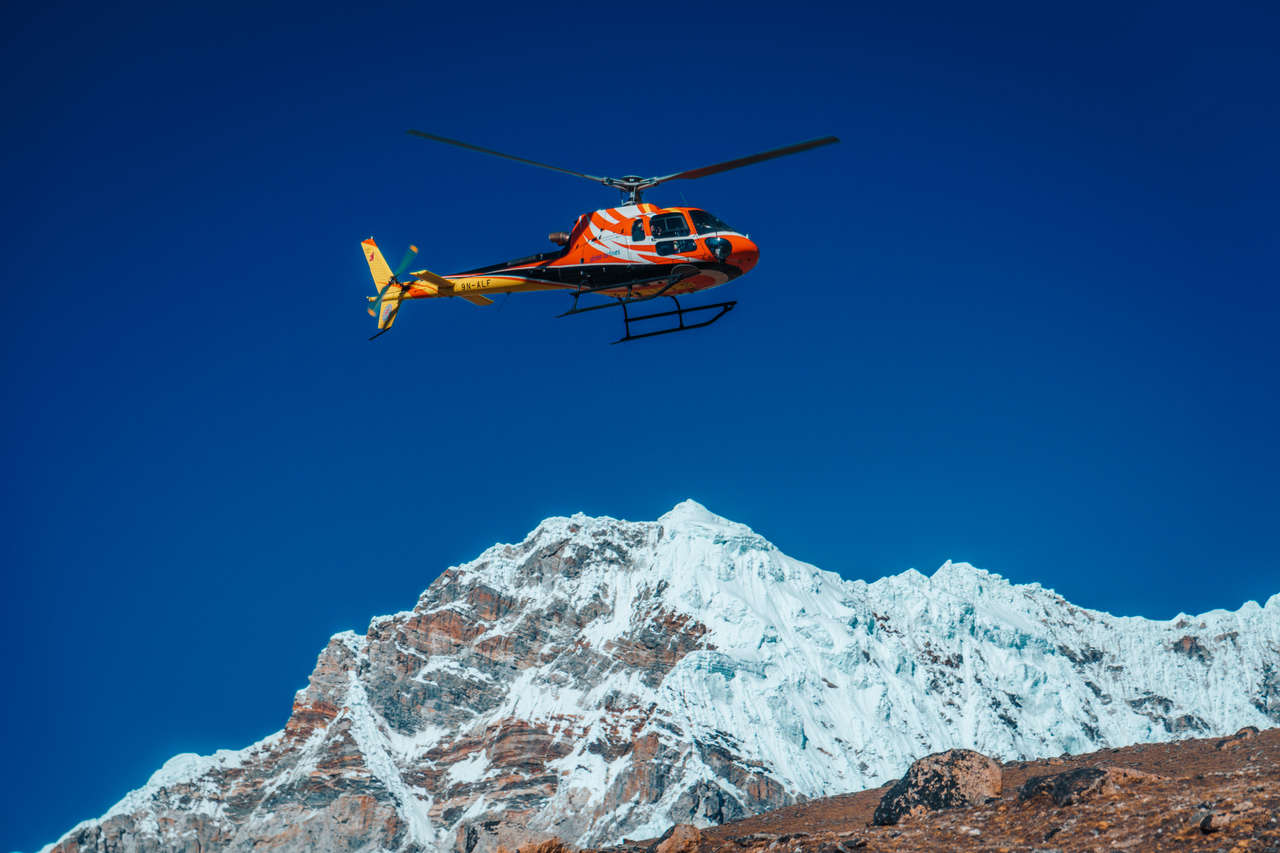 A helicopter flying at Everest Base Camp, Nepal