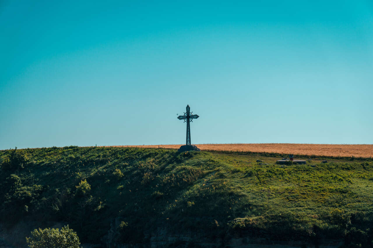 The Cross and the Monument of the 7 Cultures in Kamianets-Podilskyi, Ukraine.