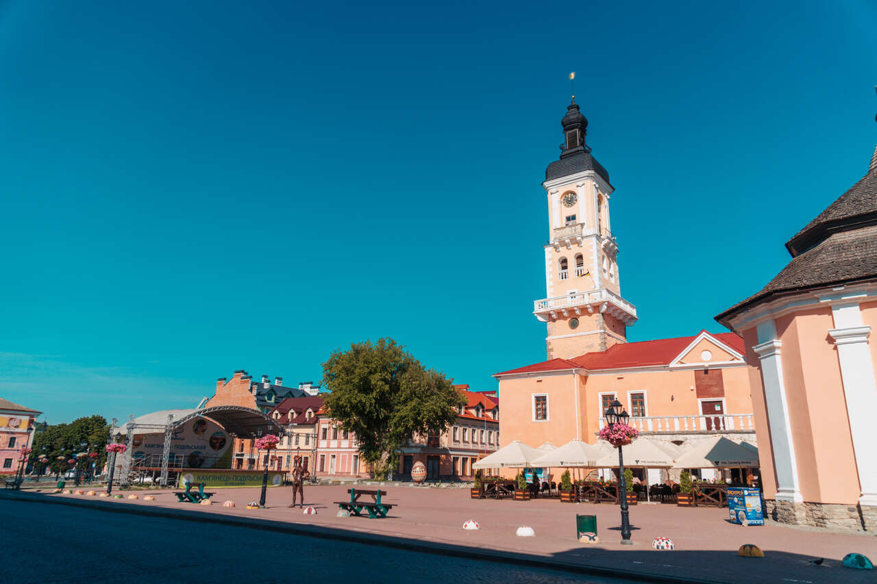 Kamianets-Podilskyi's Town Hall and the famous Tourist Statuie in Ukraine.