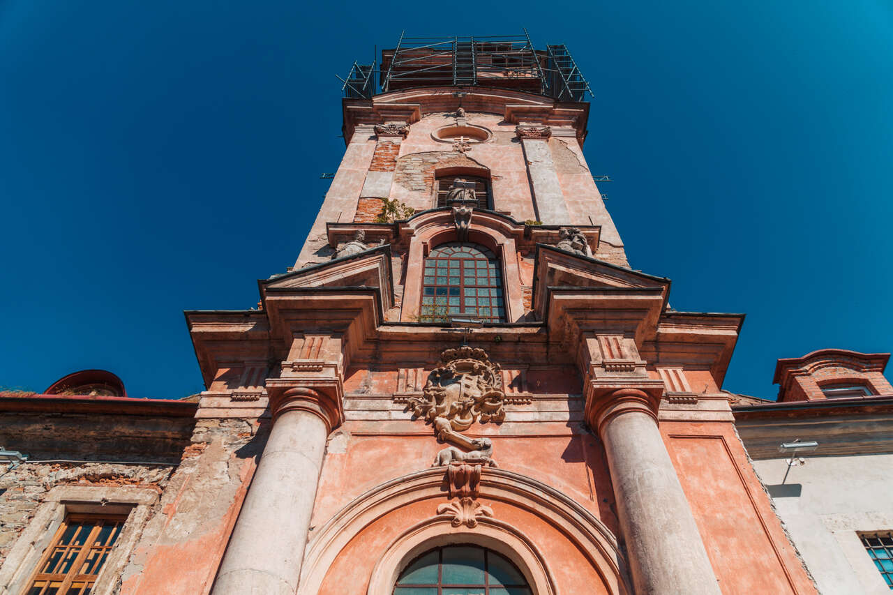 The beautiful red-white-colored facade of Dominican Monastery in Kamianets-Podilskyi, Ukraine.