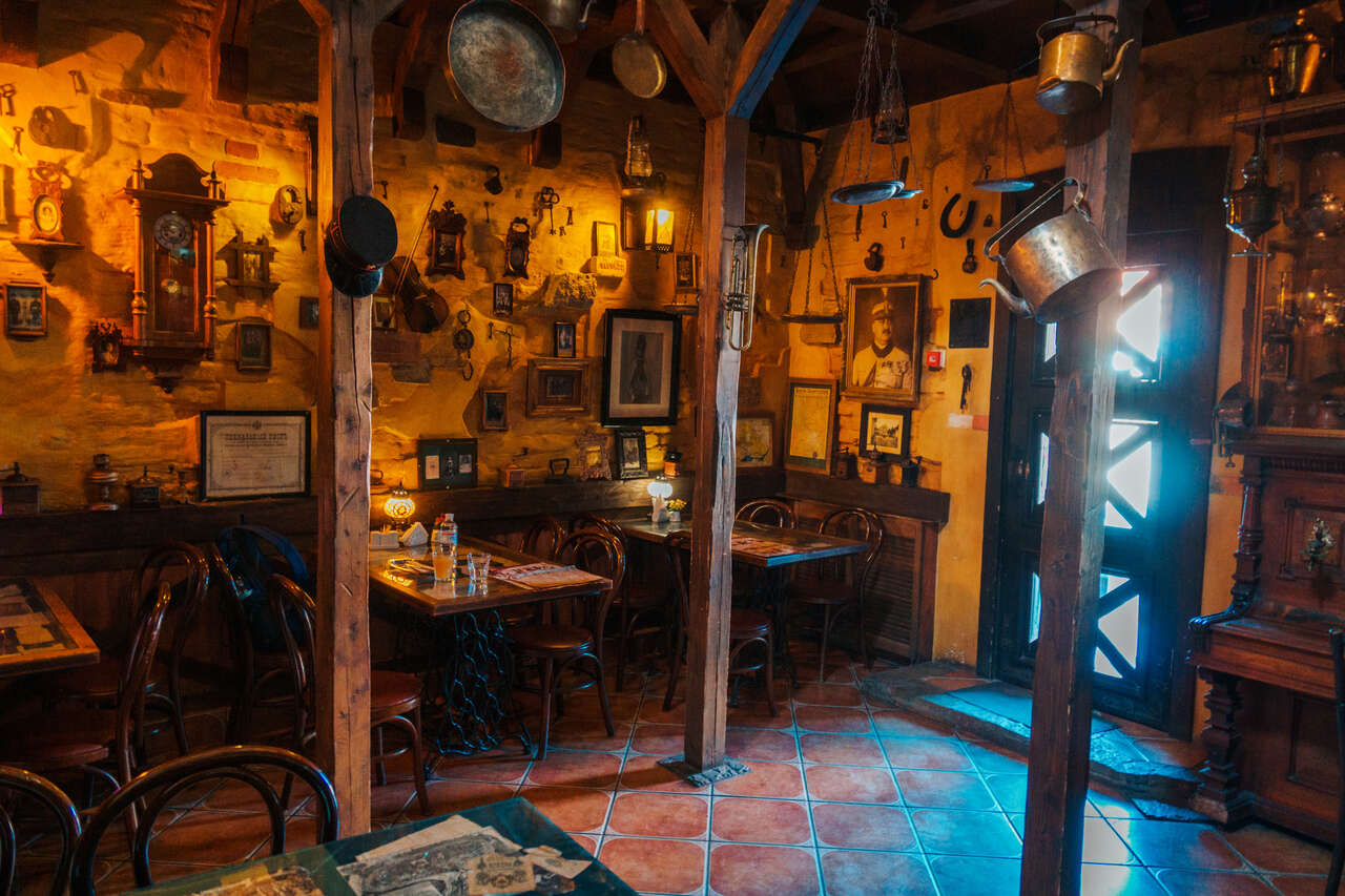 The seating area of Kava Vid Politsmeystera cafe in Kamianets-Podilskyi, Ukraine.