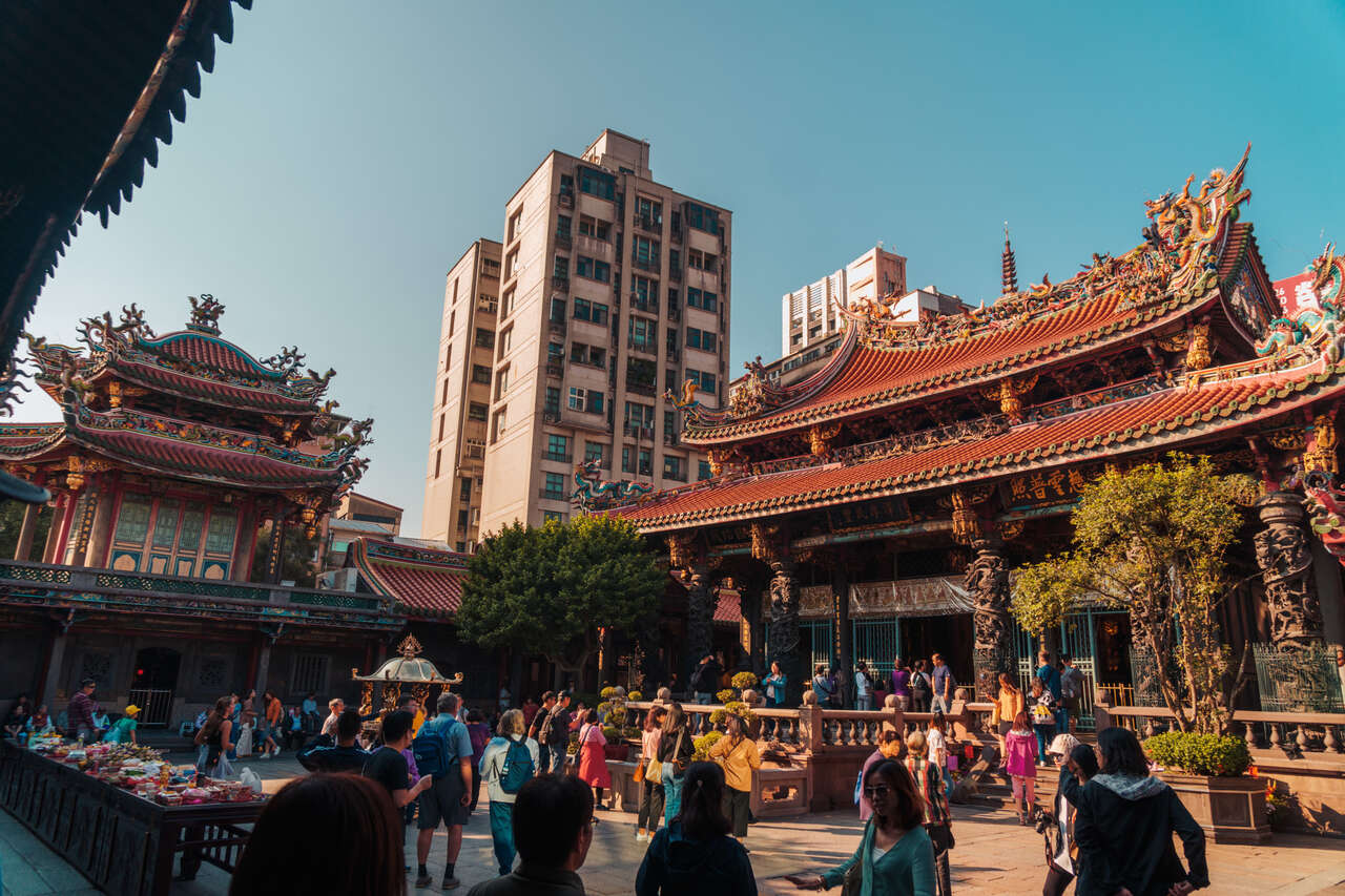 The crowded courtyard of Longshan temple in Taipei, Taiwan.