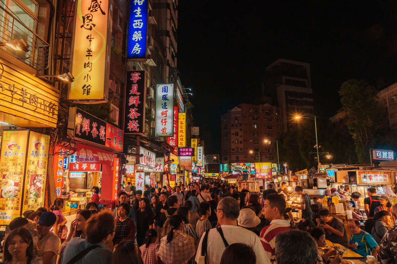 The Crowded Ningxia Night Market full of street food trucks in Taipei, Taiwan.