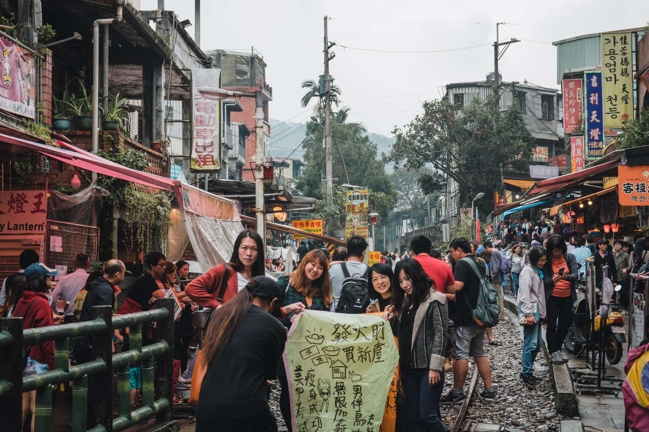 People releasing floating lanterns in Shifen, Taiwan.