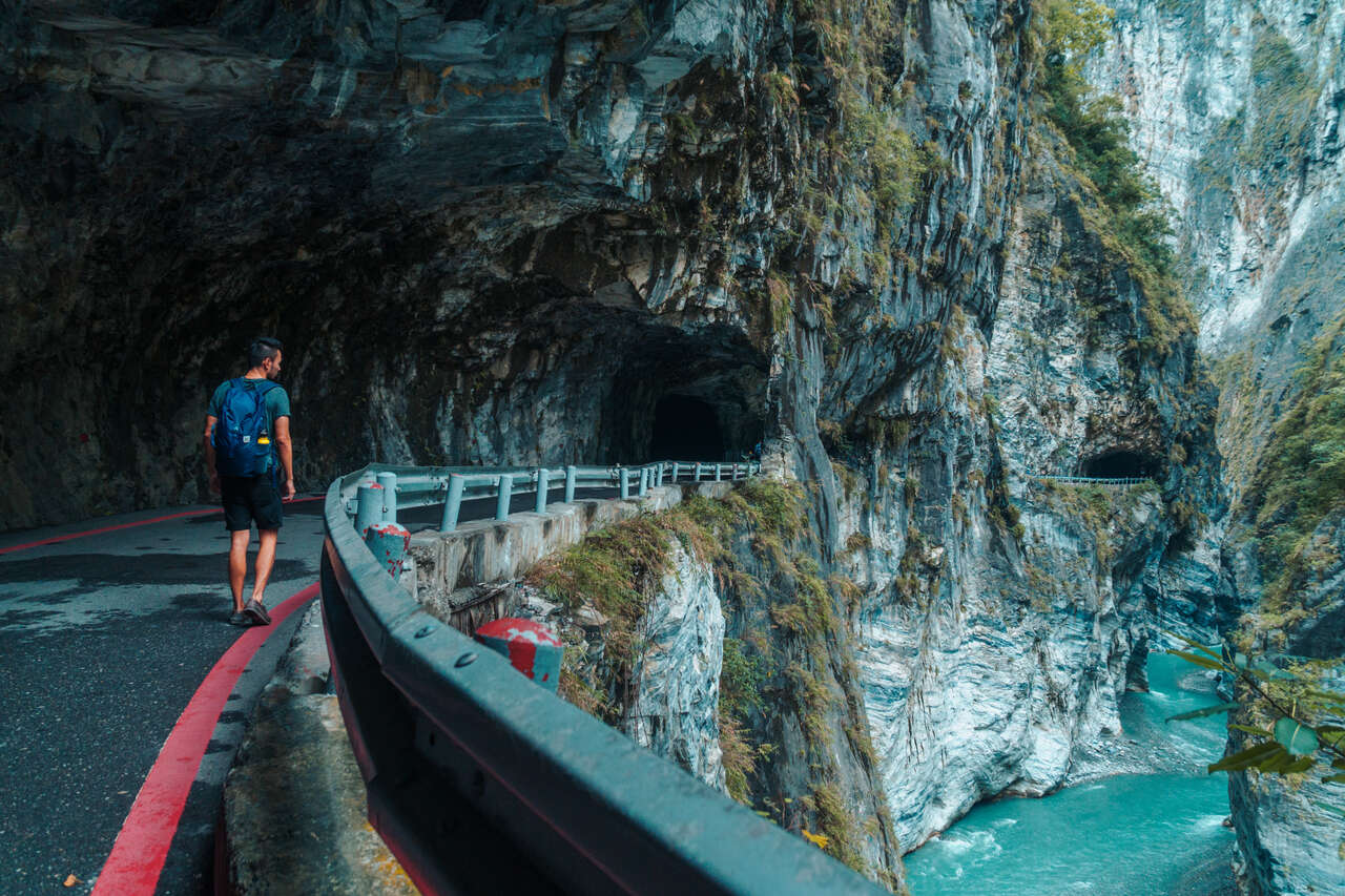 Me walking along the narrow road of Swallow Grotto Trail in Taroko, Taiwan.