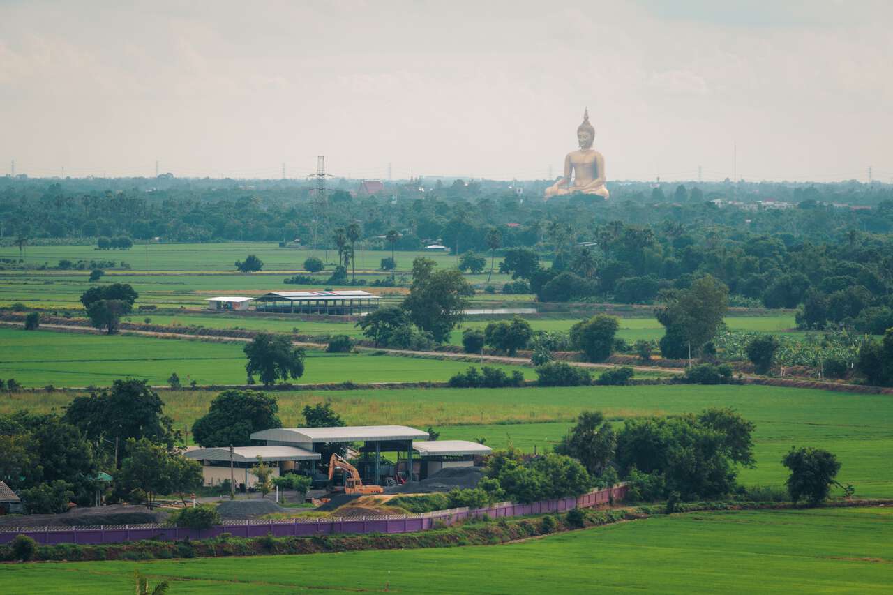 The view of Wat Muang from the top of the golden pagoda at Wat Tha It in Ang Thong.