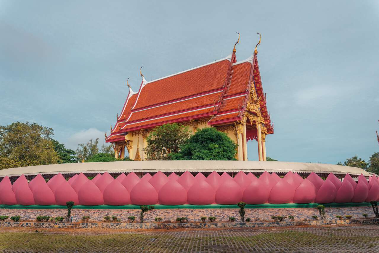 A temple elevated by Lotus shaped wall at Wat Muang in Ang Thong.