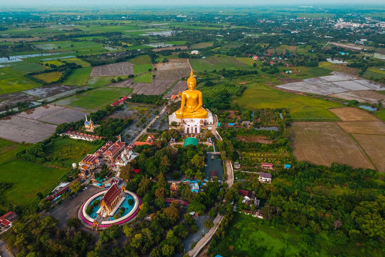 An aerial view of the Great Buddha of Thailand and Wat Muang in Ang Thong