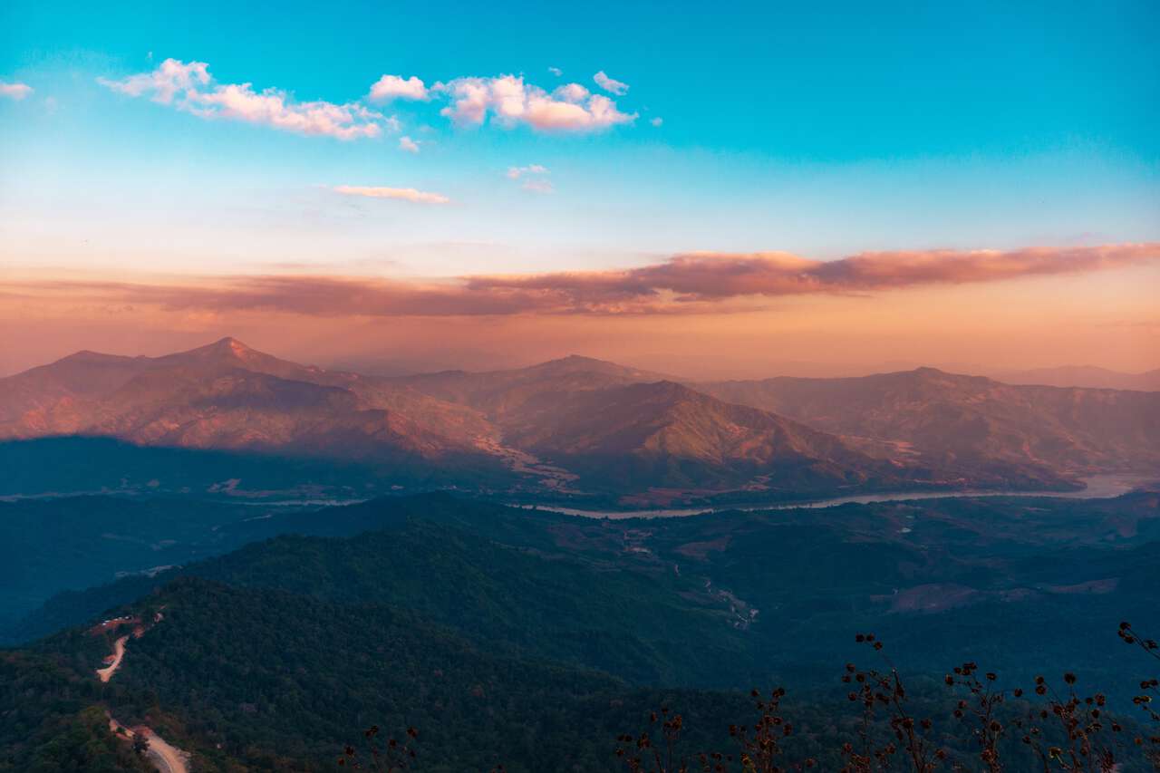 The Mekong River in Laos seen from Doi Pha Tang at sunset in Chiang Rai