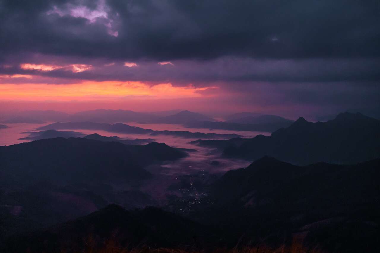 The view from Phu Chi Fa at sunrise on a cloudy morning in Chiang Rai
