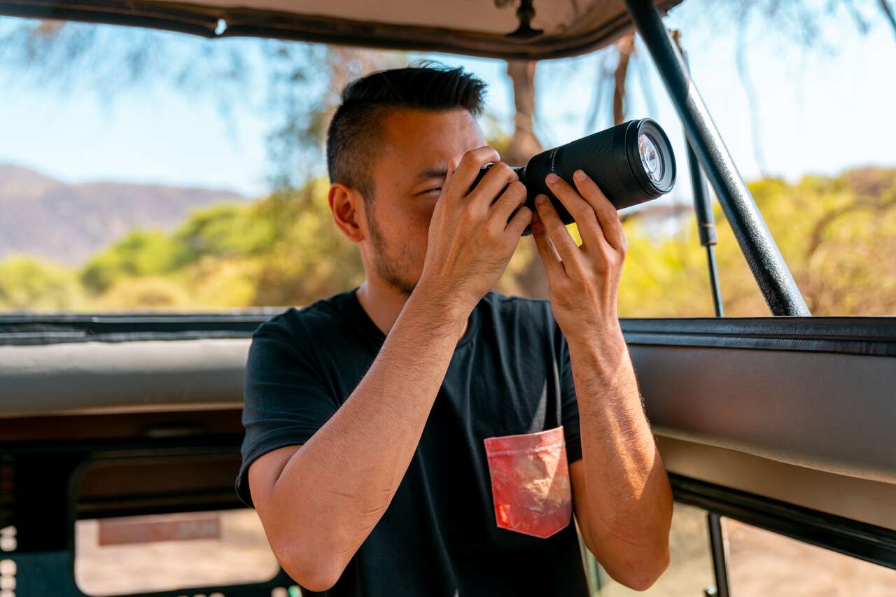 A person taking photos with a Sony camera in Africa