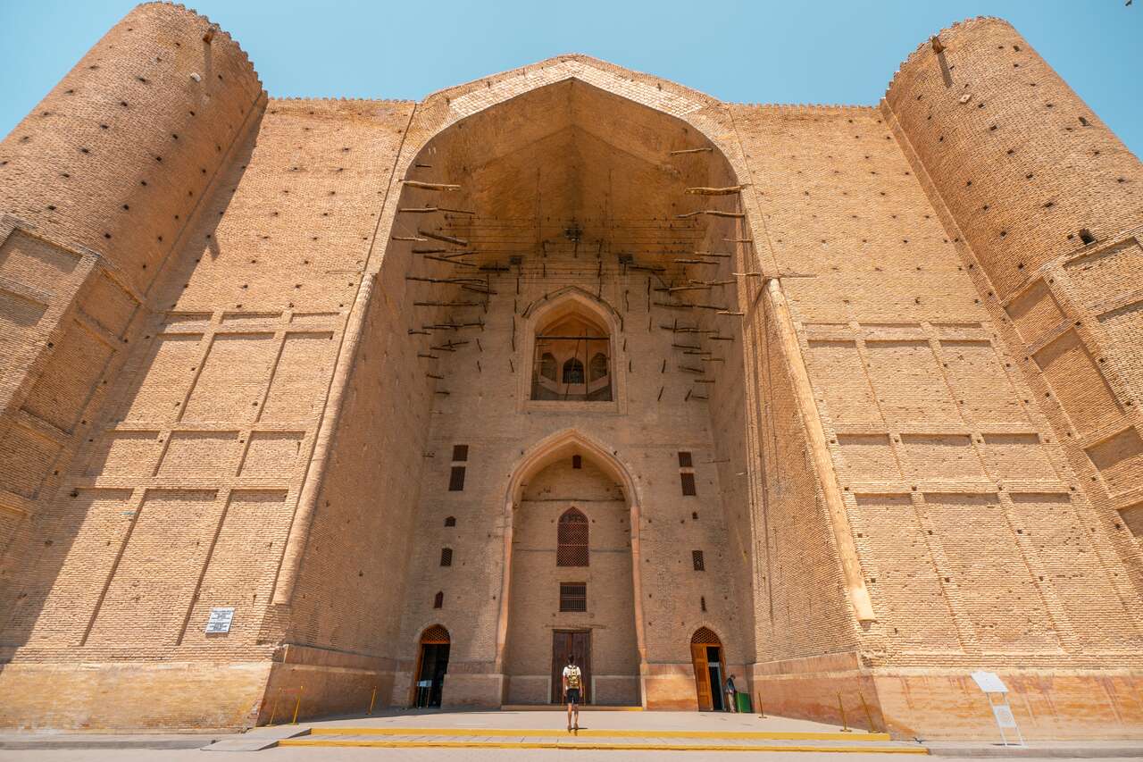 A person walking towards Mausoleum of Khoja Ahmed Yasawi in Turkestan