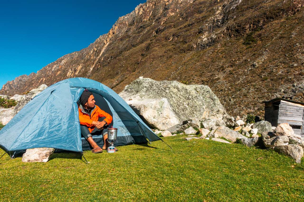 A person sitting in a tent at Santa Cruz trail