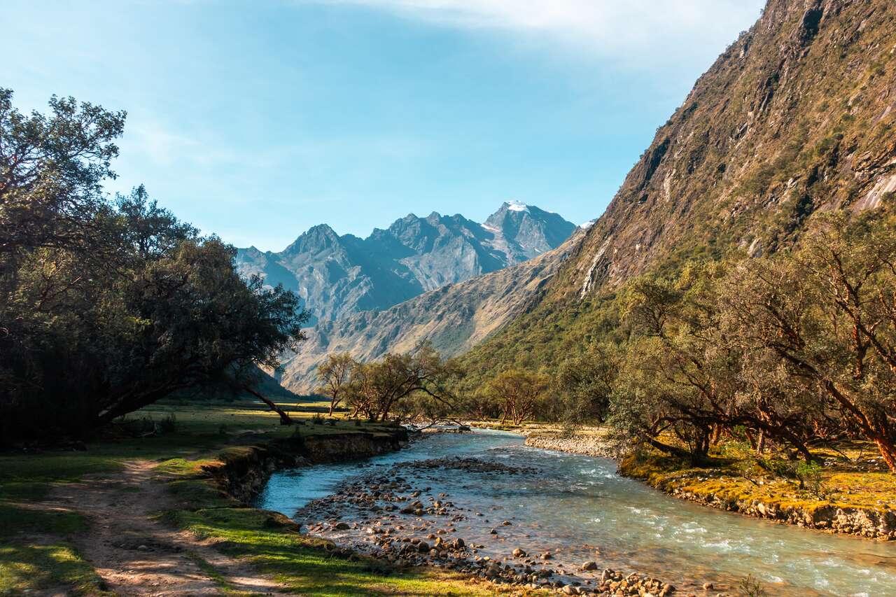 A trail by the river in Santa Cruz trail in Huaraz
