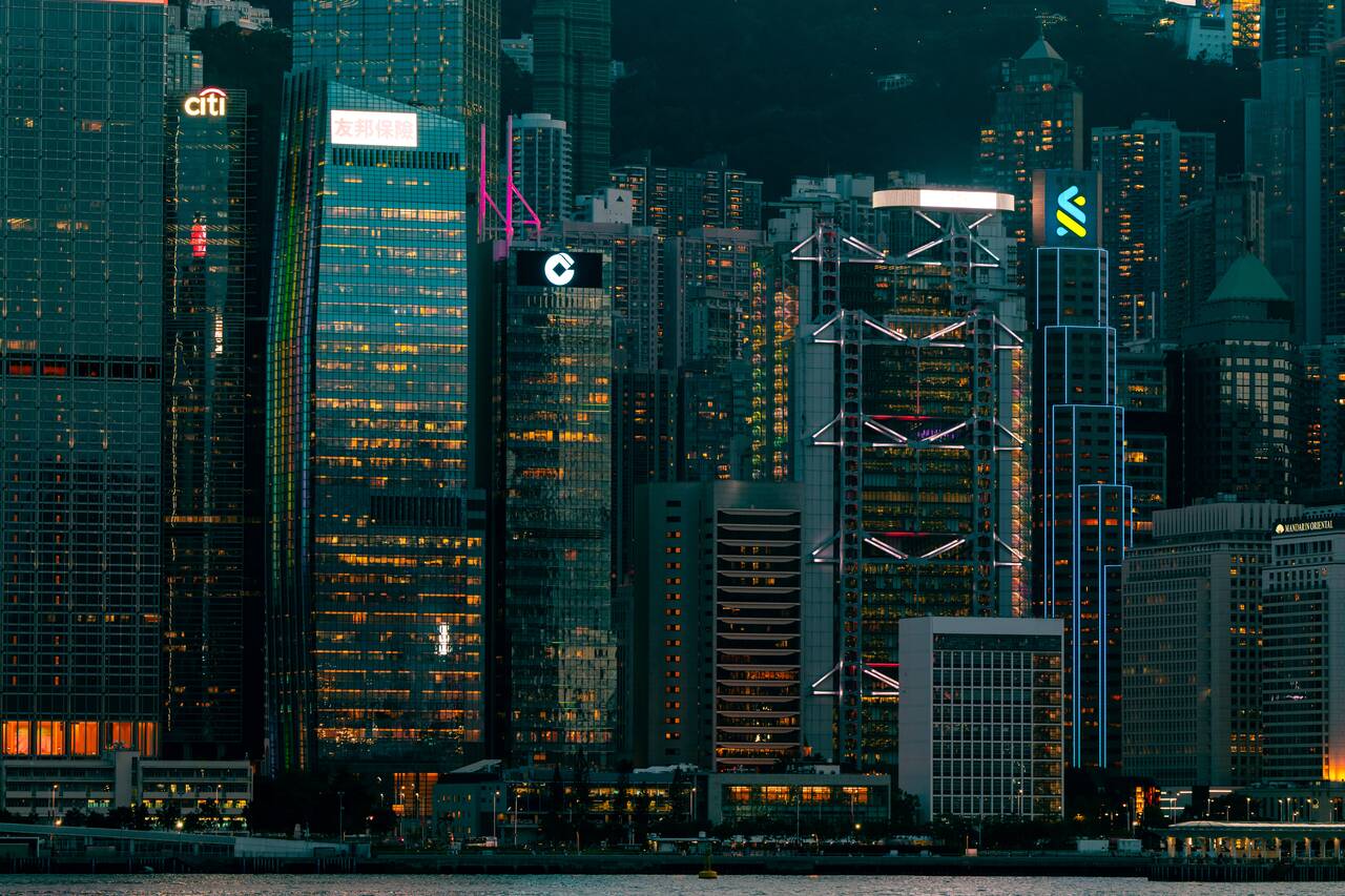 Skyscrapers seen from Victoria Harbor at night