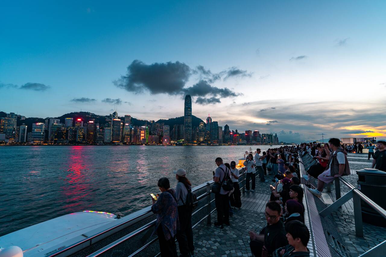 People watching sunset at Victoria Harbour