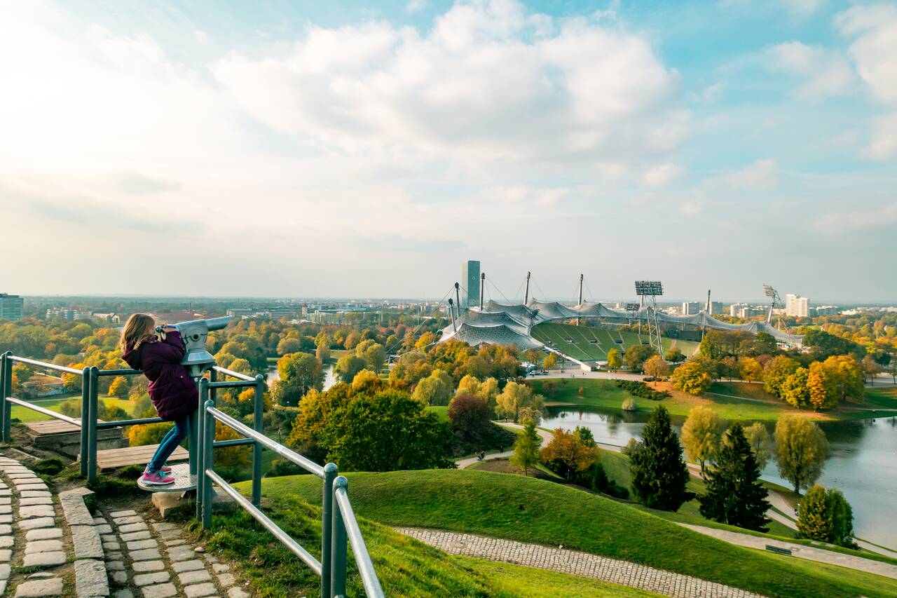 A kid using a binocular at Olympic Park
