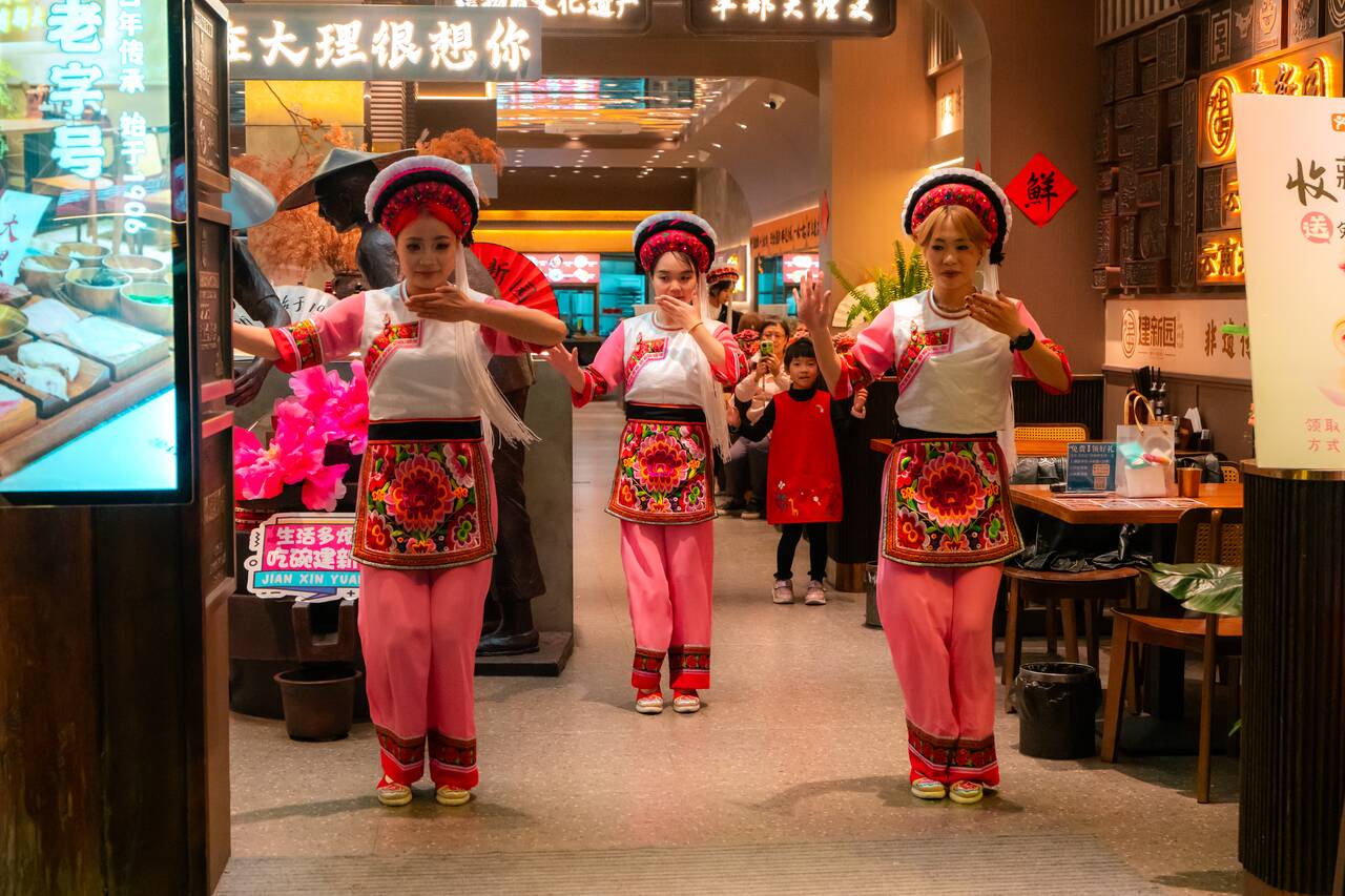Local dancing in front of a restaurant