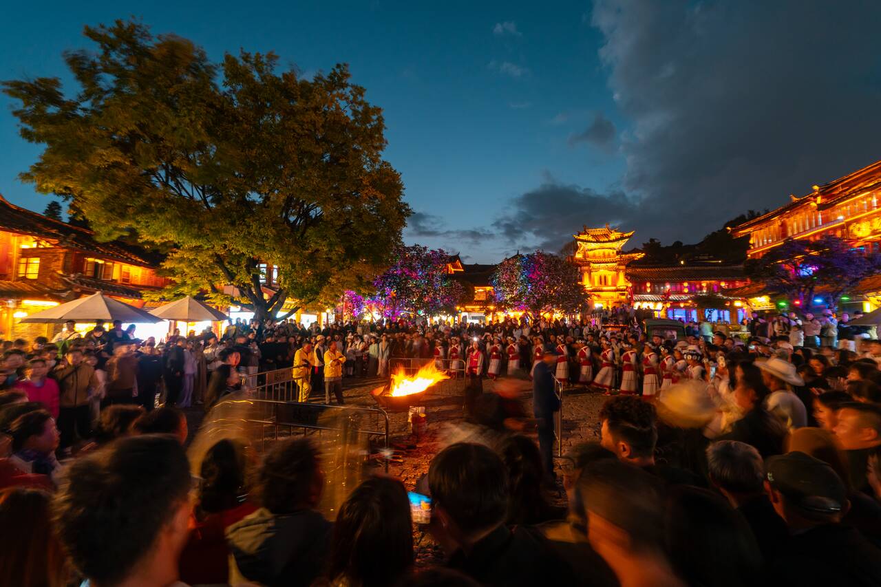 Locals dancing the bonfire ritual at Sifang Street Square