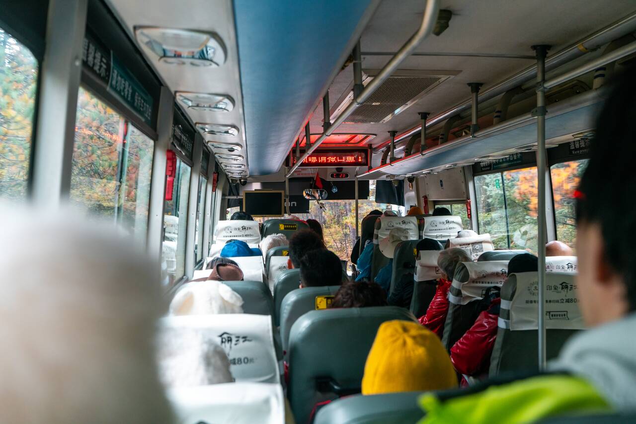 Inside a shuttle bus in Yulong Snow Mountain
