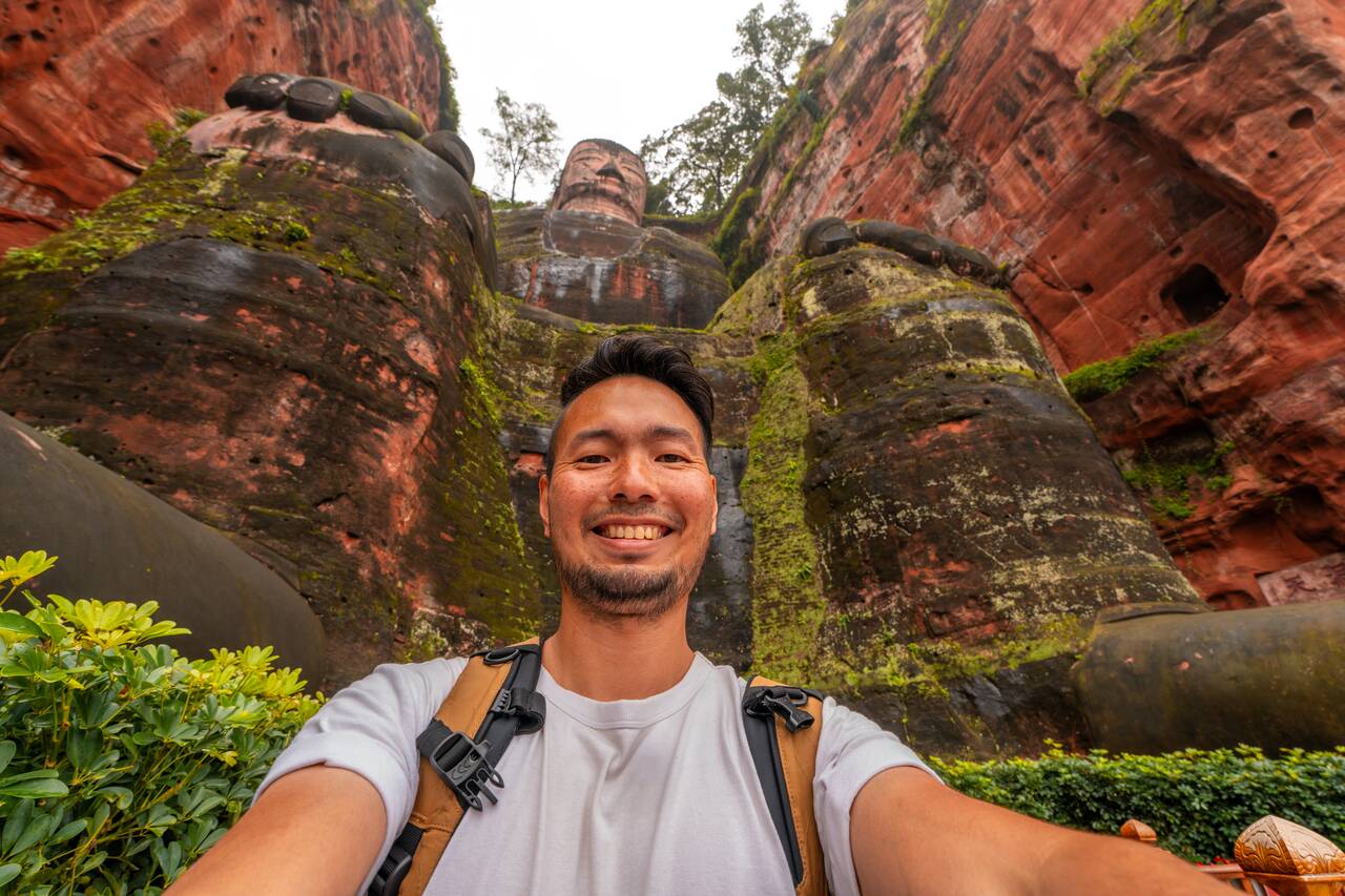 Me posing at the foot of Giant Leshan Buddha