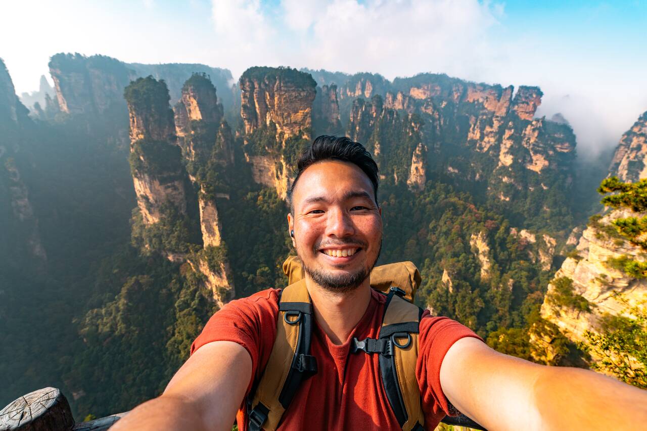 Me posing at the mountains at Yuanjiajie