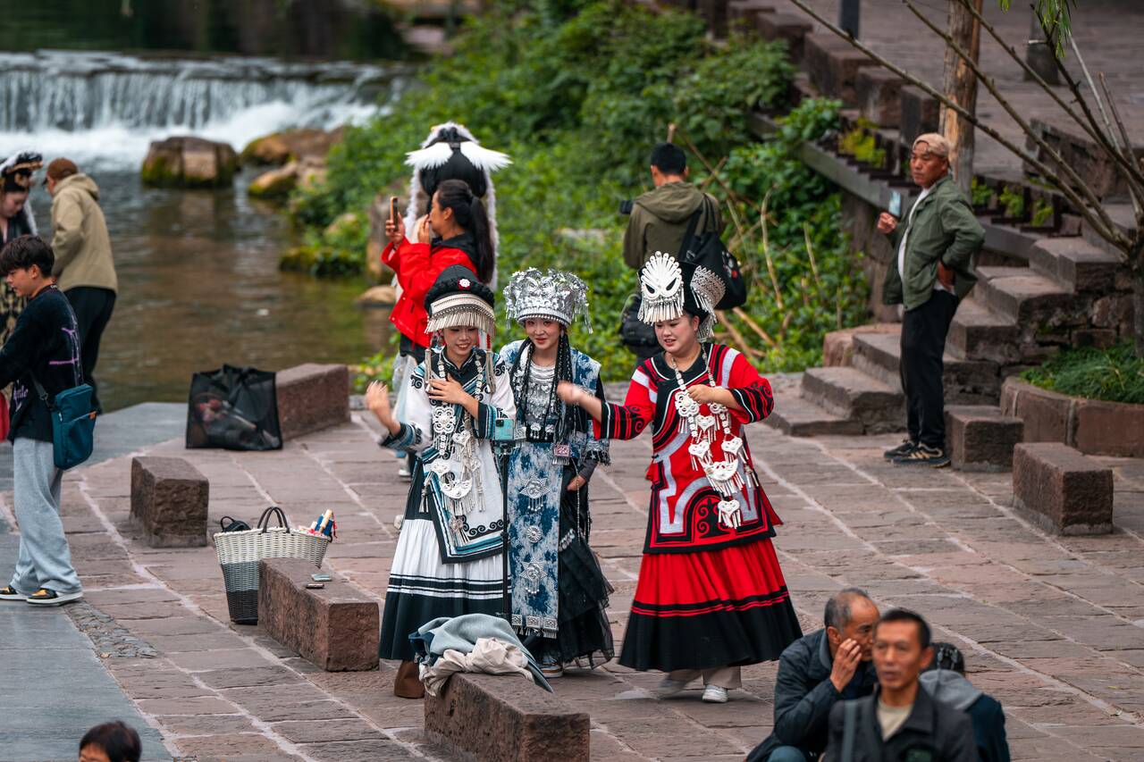 Local women dancing tiktok at Fenghuang