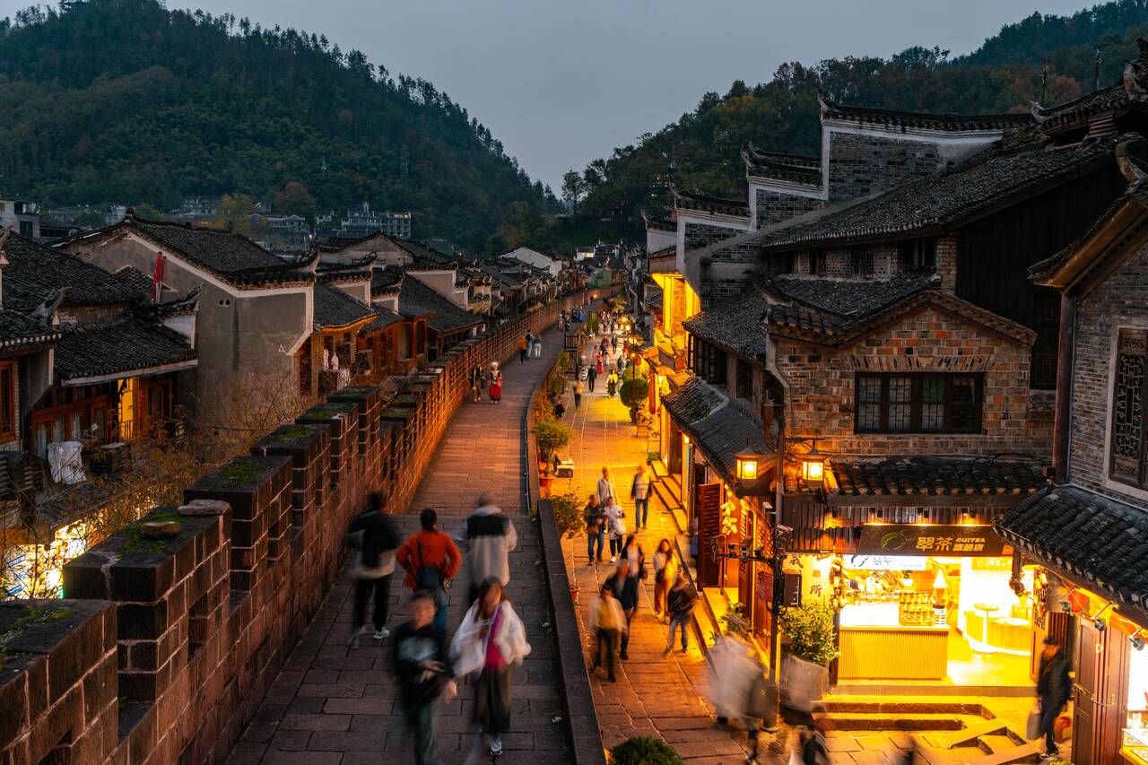 People walking along the walls of Fenghuang