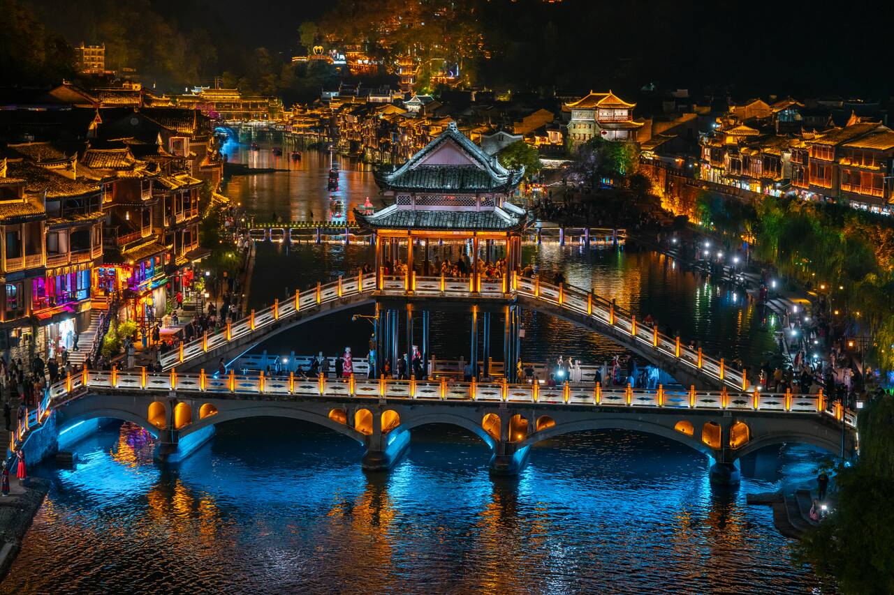 Snow bridge at Fenghuang Ancient Village at night