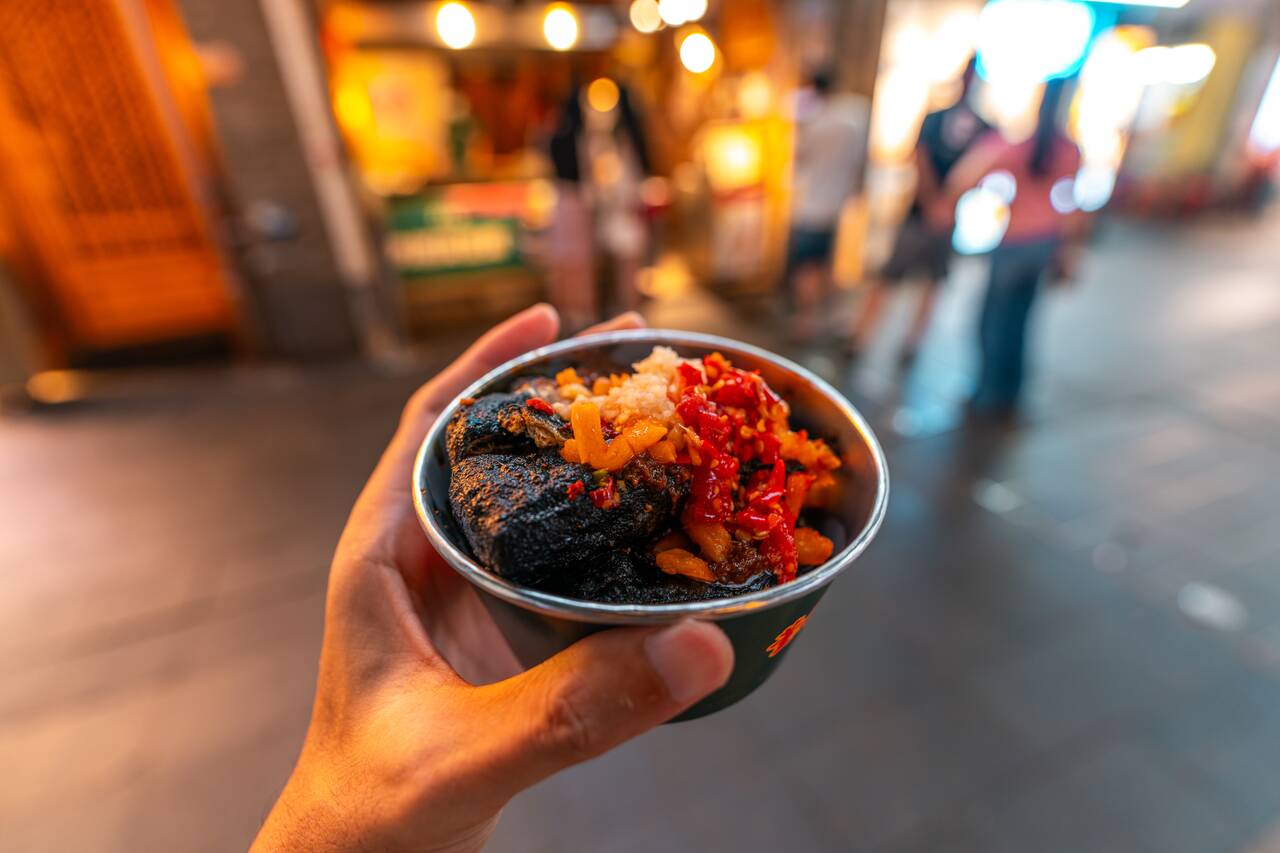 Me holding street food at Beijing Street in Guangzhou