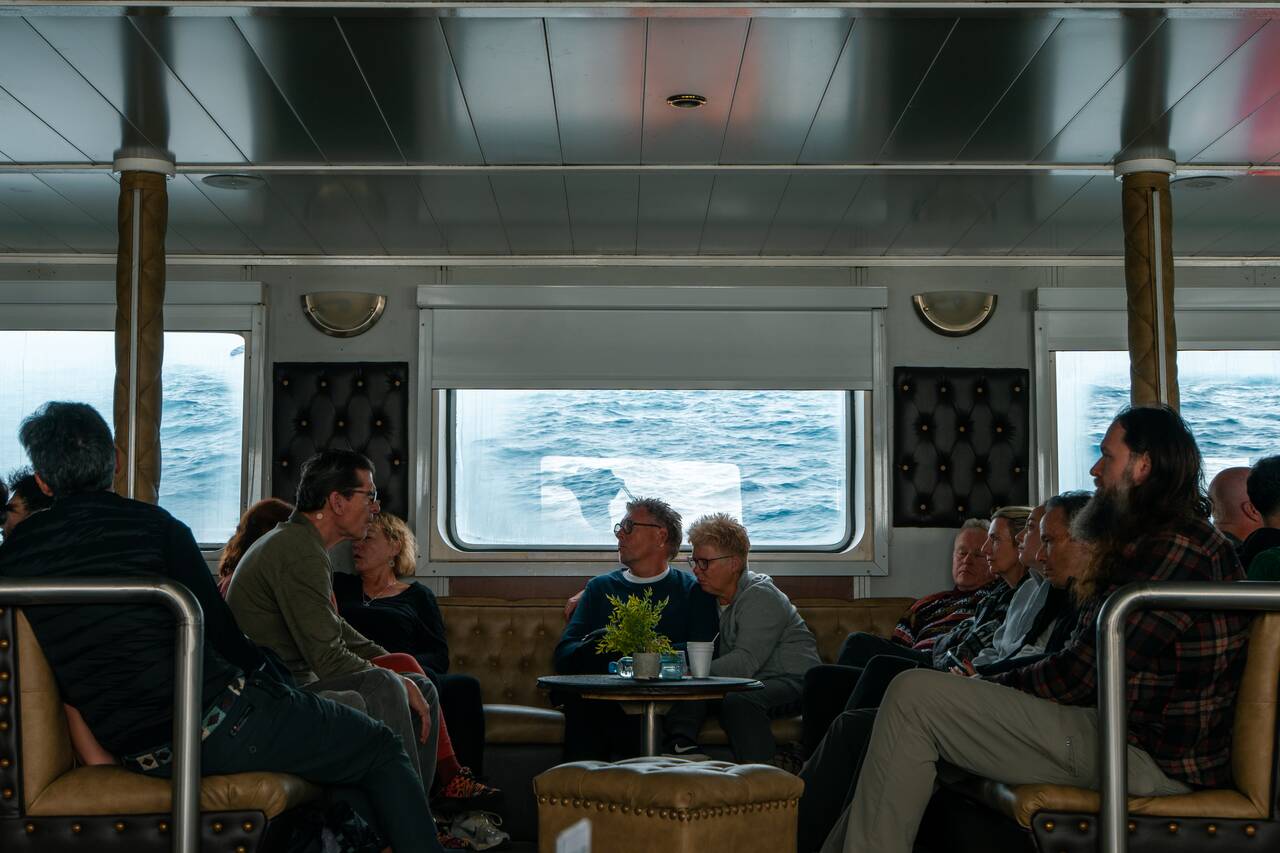 People dealing with the swell during the Drake Passage Traversal to Antarctica