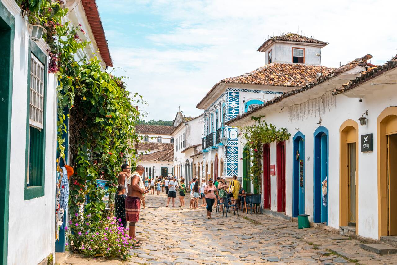 Colorful street full of people in Paraty