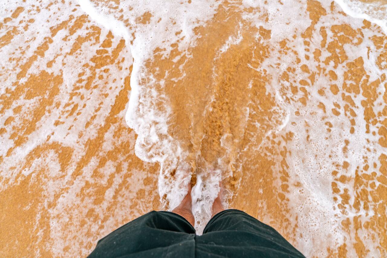 My feet at the beach in Paraty