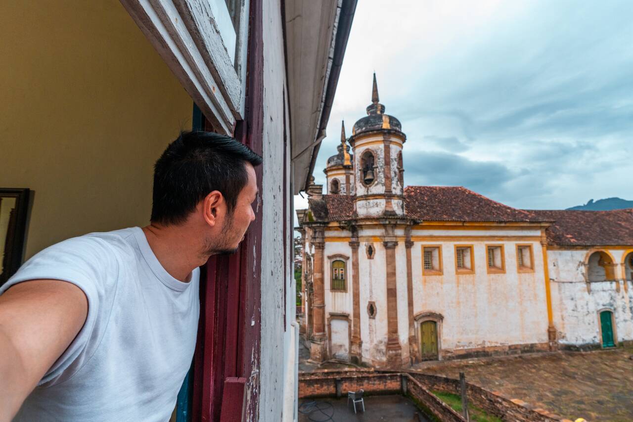 Me looking out the window from a colonial inn in Ouro Preto
