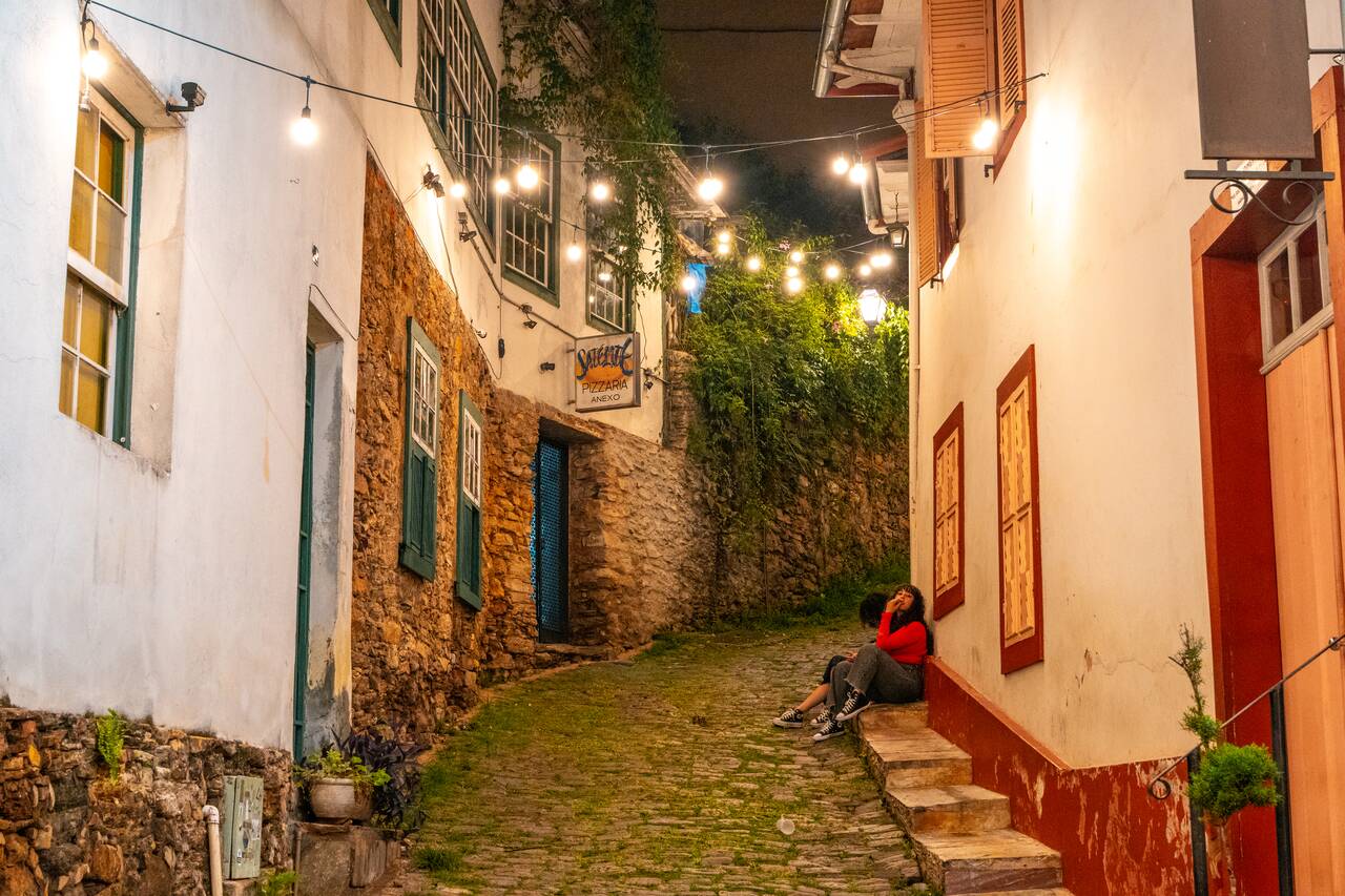 A woman smoking in the street of Ouro Preto