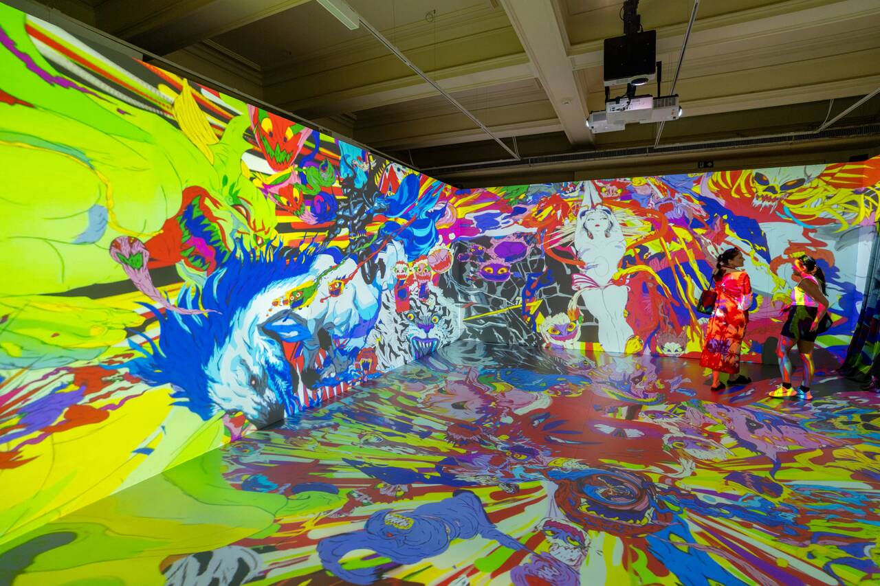 A room featured Amano's colorful artwork projected across the walls at Bank of Brazil Cultural Center