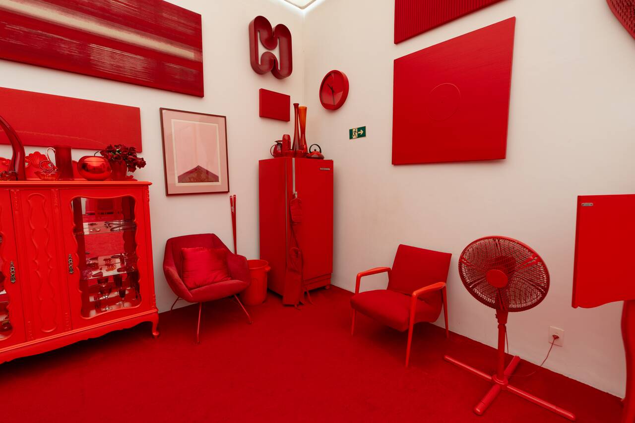 Red furnitures at Cildo Meireles Gallery