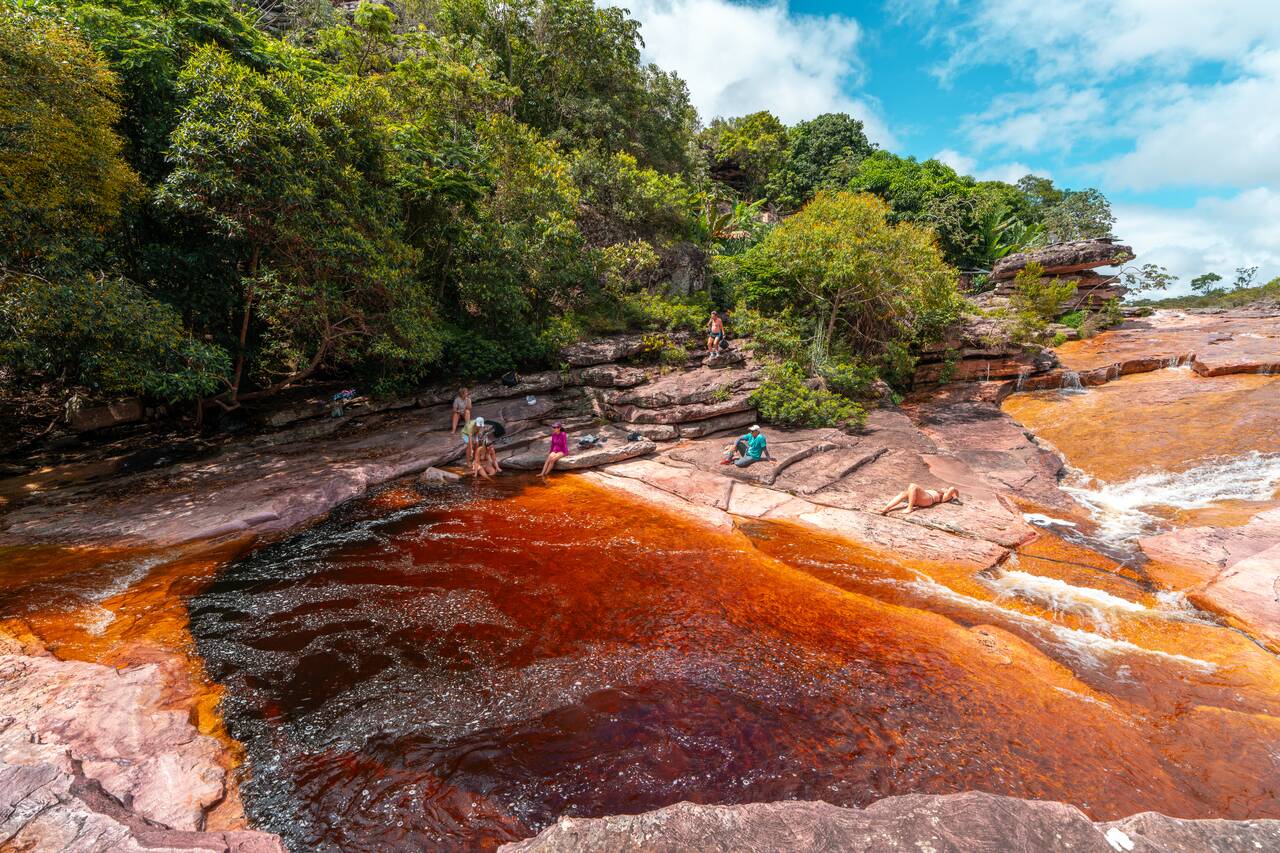 People hanging out by Poço do Diabo