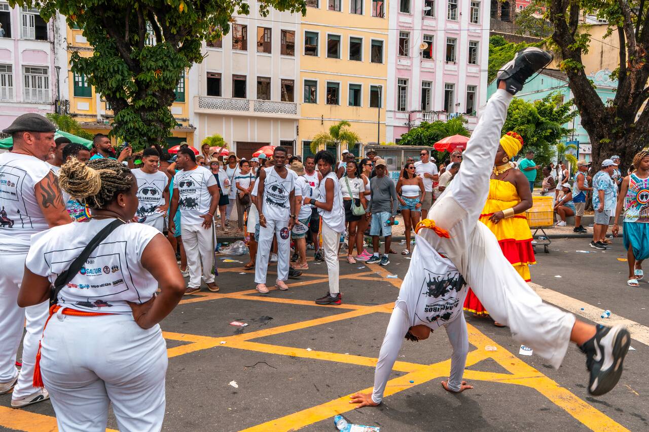 A group of people doing Brazilian capoeira at Bonfim Festival