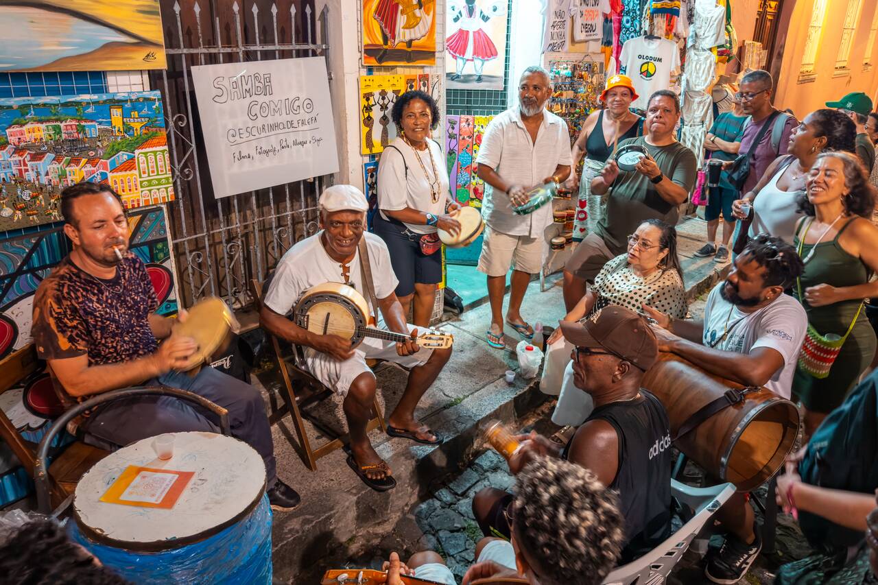 People dancing as the local band playing on the streets in Salvador