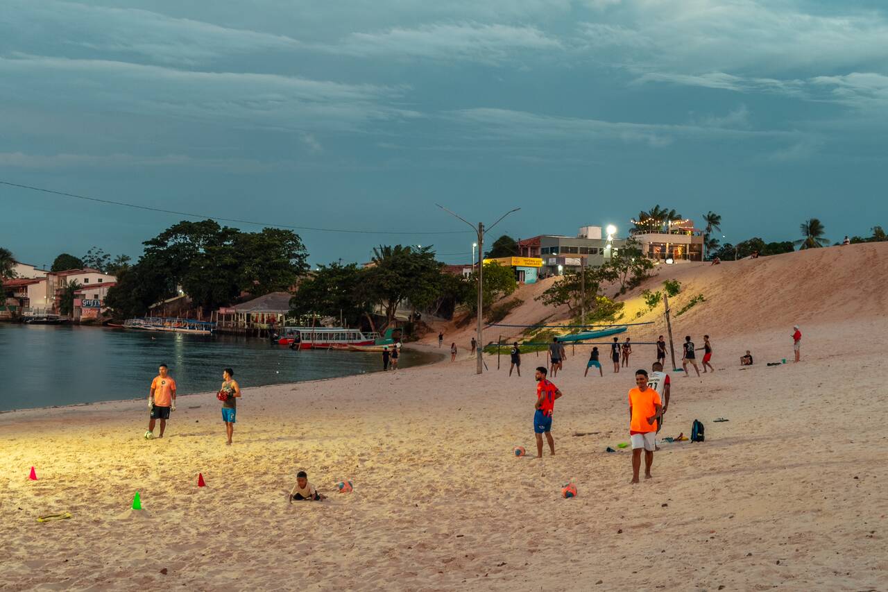 Locals playing volleyball at night near the sand dune in Barreirinhas