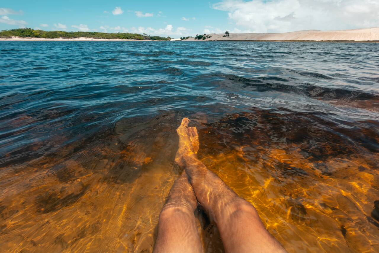 My legs in the water of Lagoa da Esperança